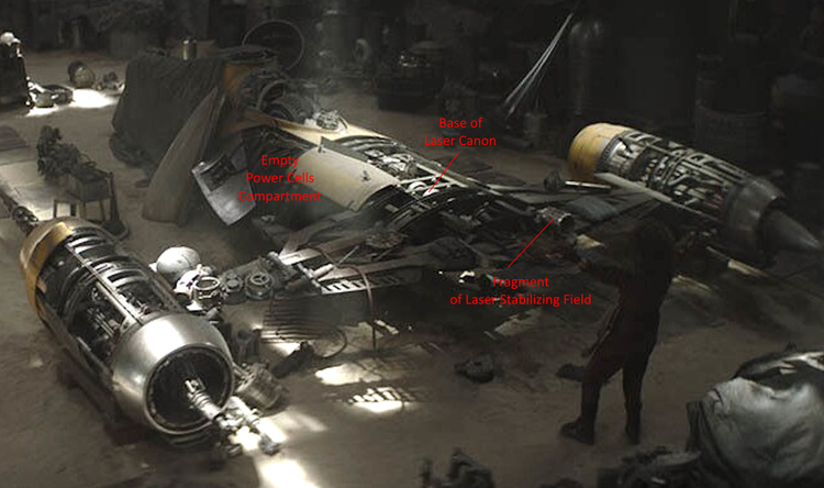 Screenshot from the Mandelorian, showing Naboo Starfighter in workshop